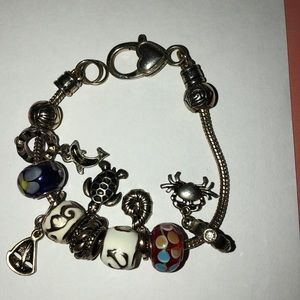 Gold beach themed charm bracelet